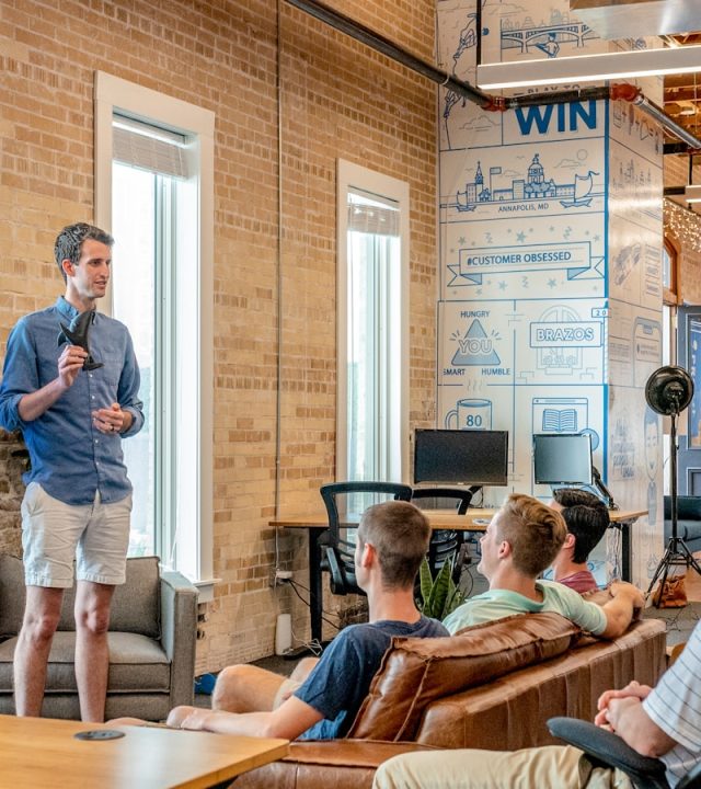 man standing in front of group of men